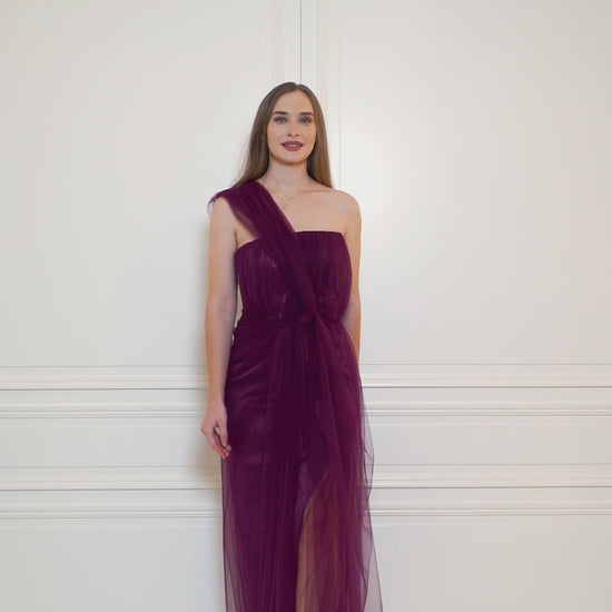 Adjustable-strap royal purple gown, featuring a slit for those majestic moments.