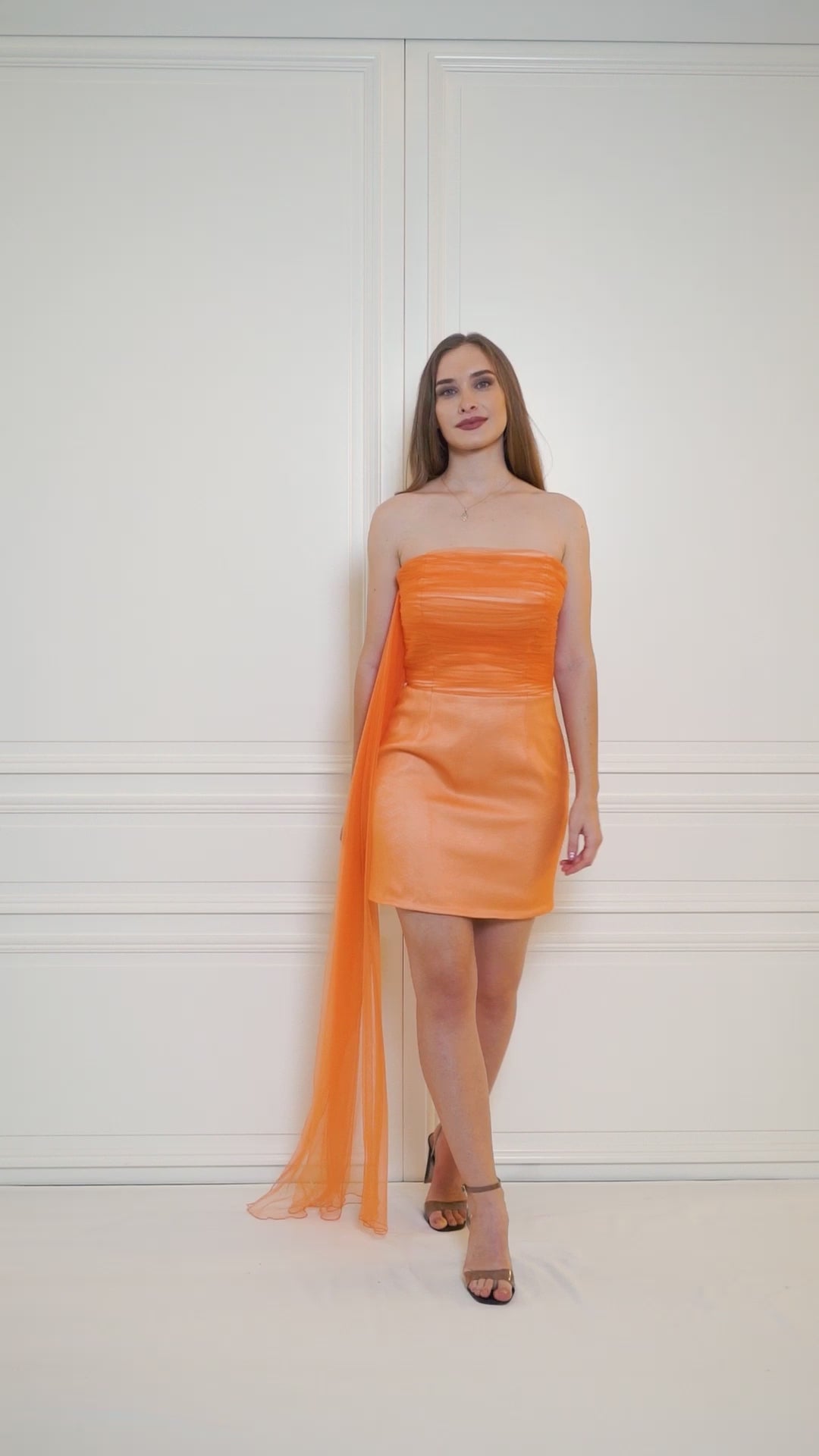 Mini strapless dress in apricot crush that steals the spotlight, adding a pop of color to your next occasion.