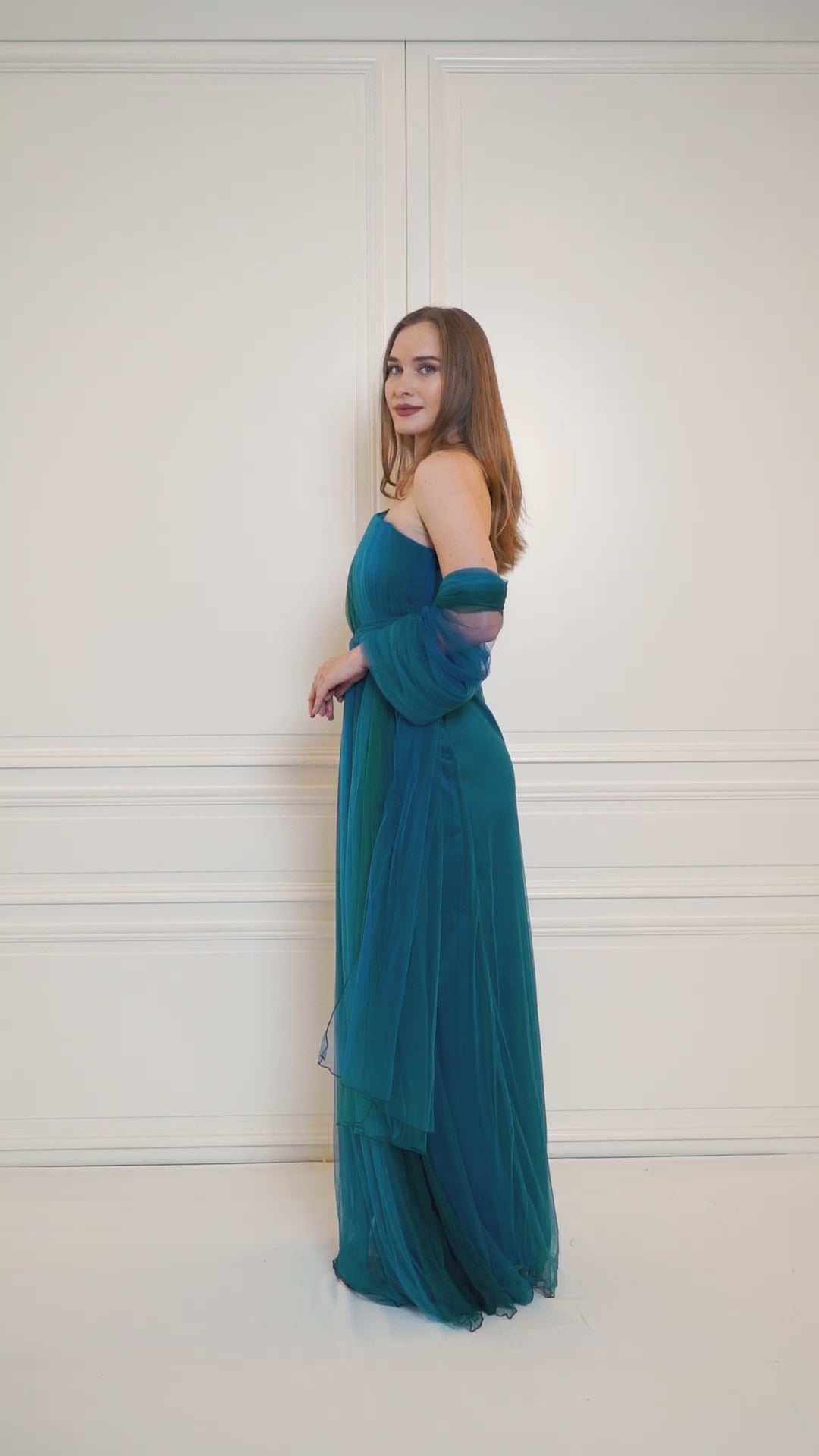 One-shoulder turquoise gradient dress, featuring a slit for added allure and crafted to perfection.